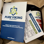 Detox Startkit uppackat i brunt papper med Pure Viking-kort och doseringsschema ovanpå burken Loki's Chain